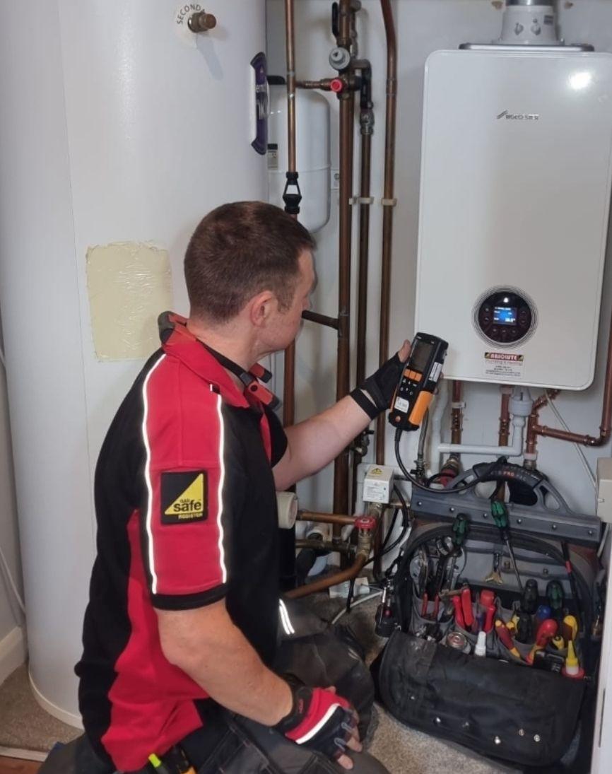 "Gas Safe engineer from Absolute Plumbing & Heating servicing a Worcester Bosch boiler in Uckfield, ensuring safe and reliable heating for local homes."