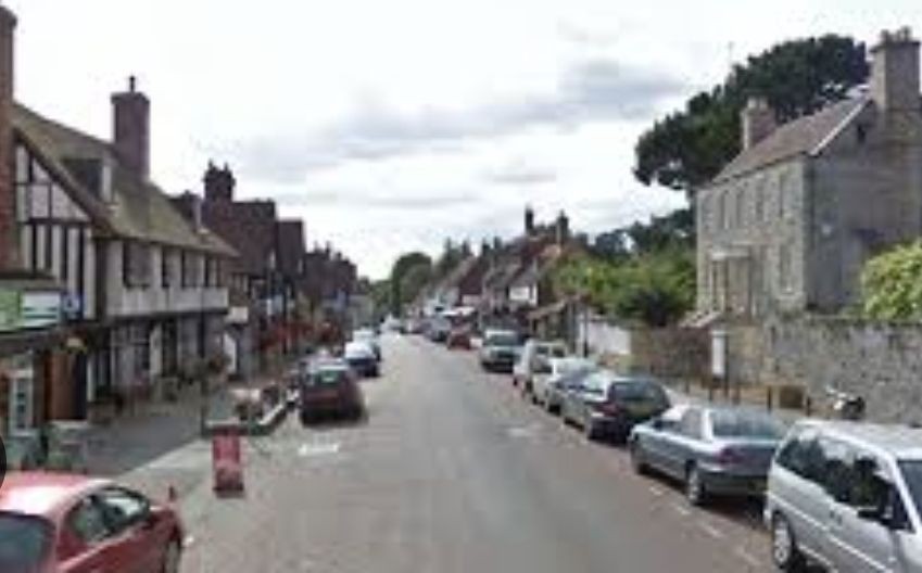 “Mayfield High Street featuring traditional shops and historic buildings.”