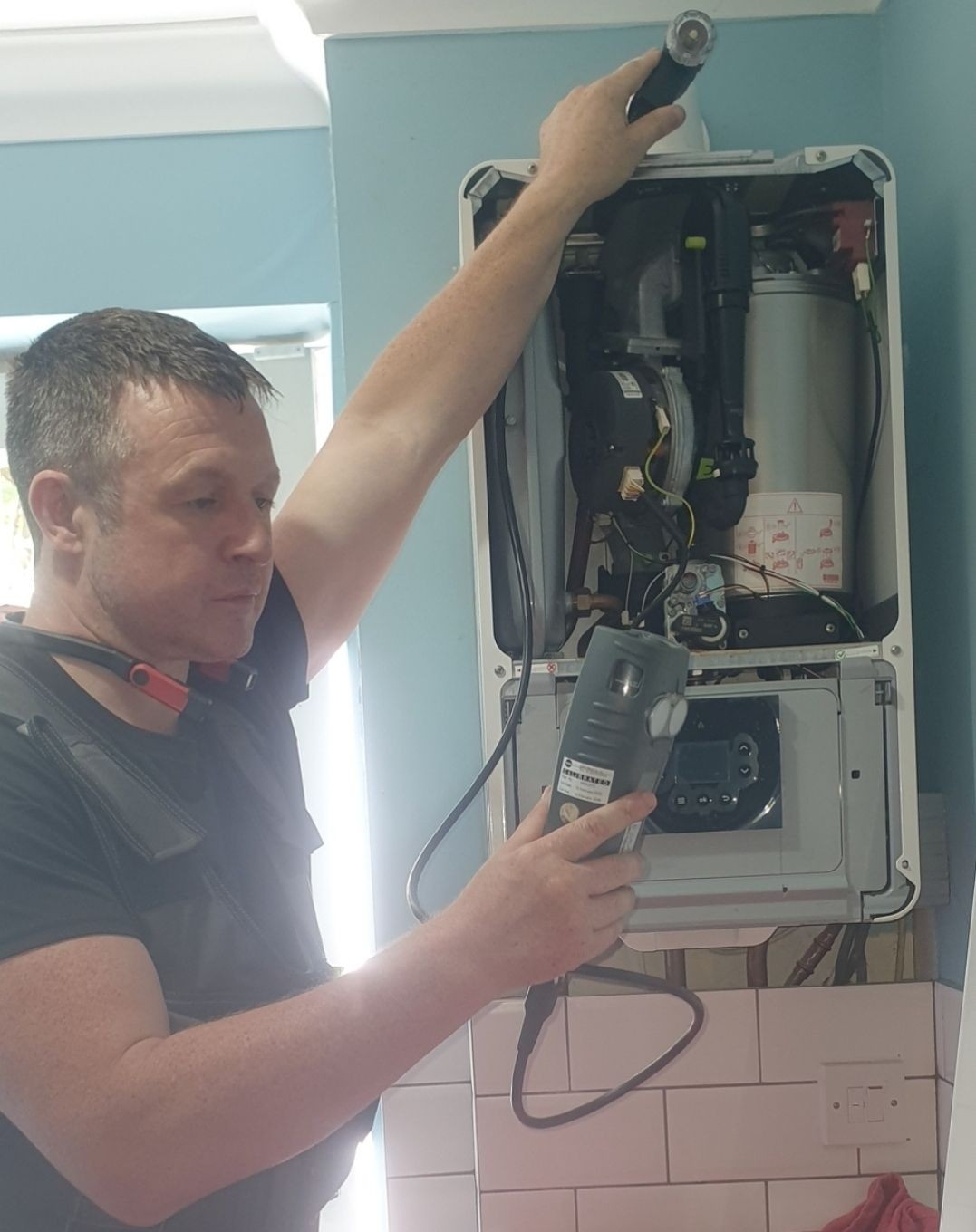 Gas Safe registered engineer servicing a boiler in a Uckfield home – Absolute Plumbing & Heating