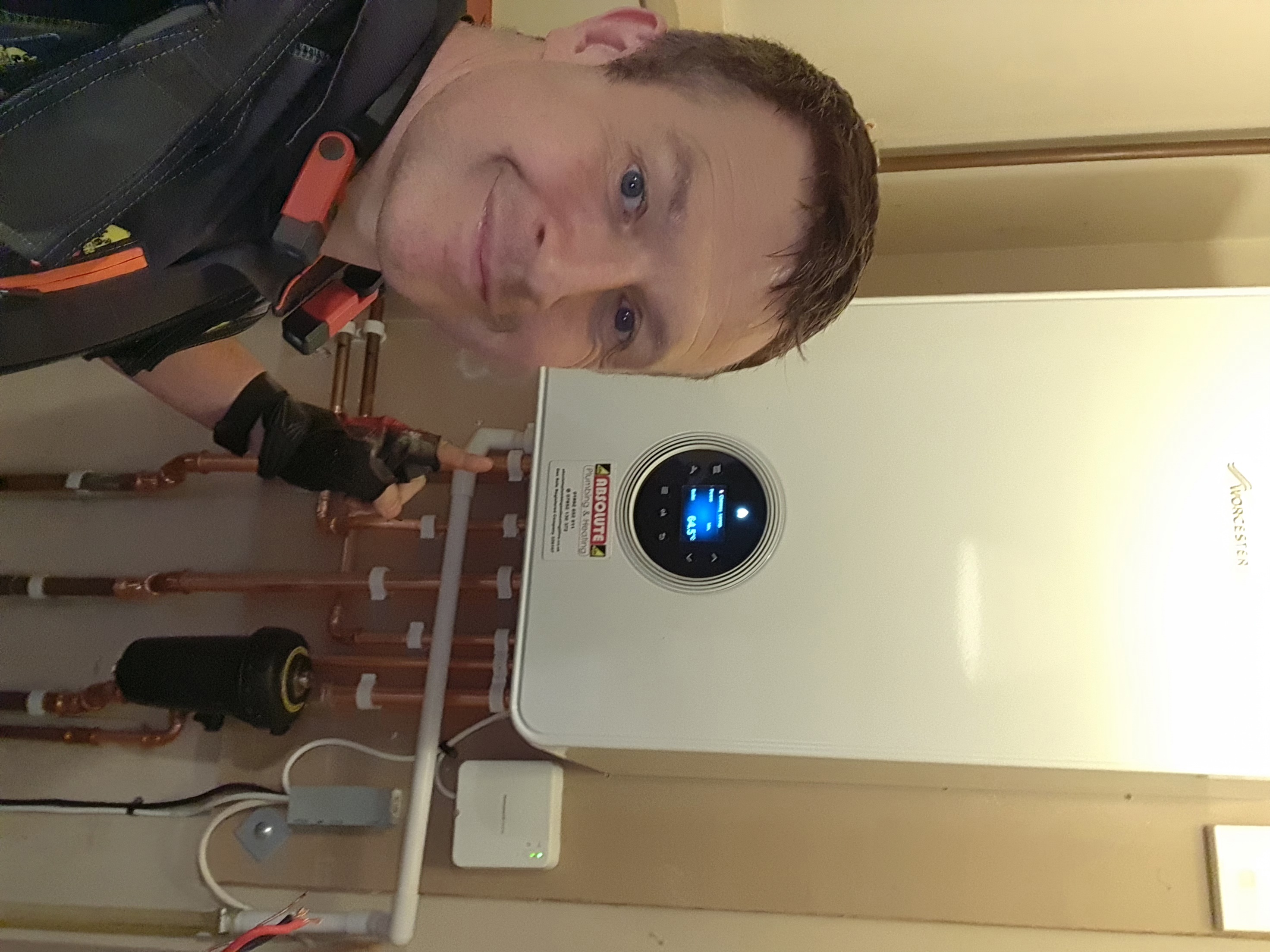 Daniel from Absolute Plumbing & Heating carrying out boiler testing during a service visit in Crowborough