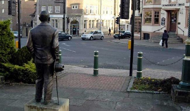 Statue of Sir Arthur Conan Doyle in Crowborough town centre, a local landmark featured on our boiler servicing page