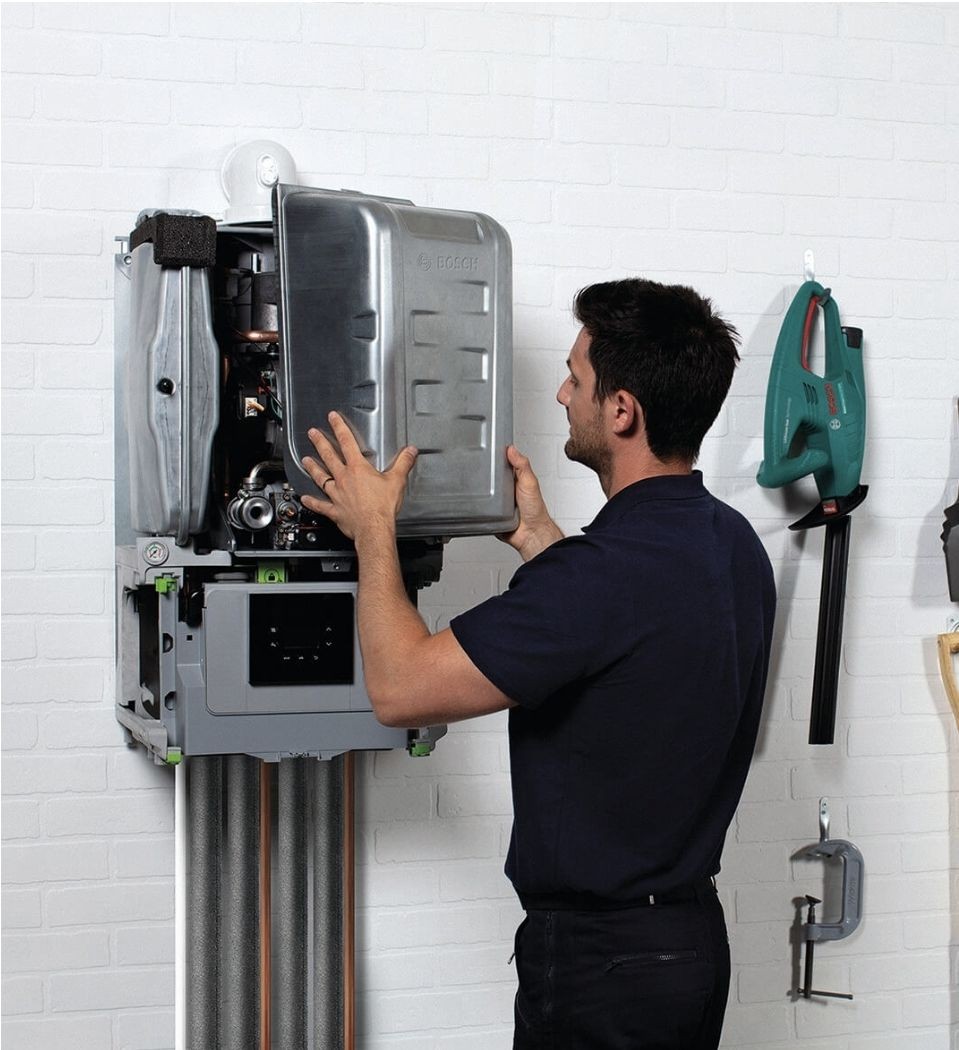 New boiler being installed by heating engineer in Tunbridge Wells home