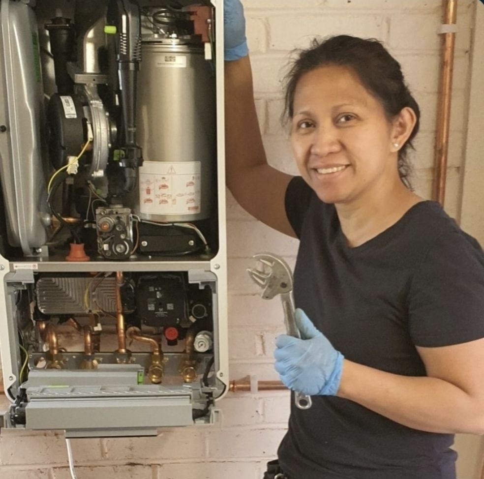 Cristina from Absolute Plumbing & Heating working on a boiler installation for a customer in Uckfield.