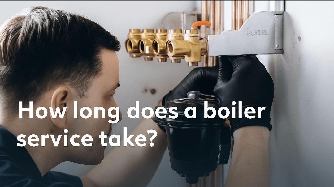 Engineer adjusting boiler pressure as part of an annual boiler service to maintain safe operation