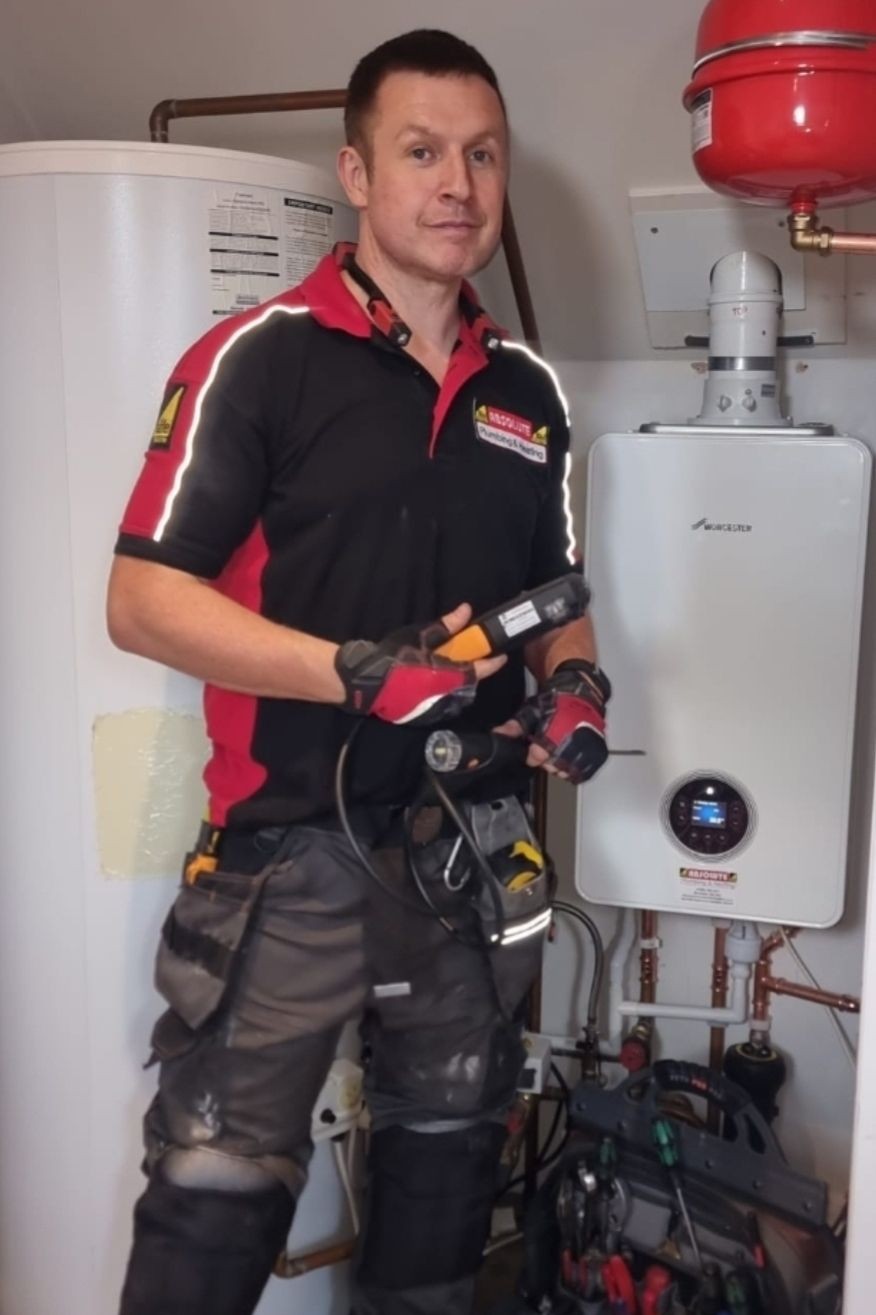 "Gas Safe registered Worcester Bosch accredited installer Daniel Angel from Absolute Plumbing & Heating fitting a new Worcester boiler in Crowborough."