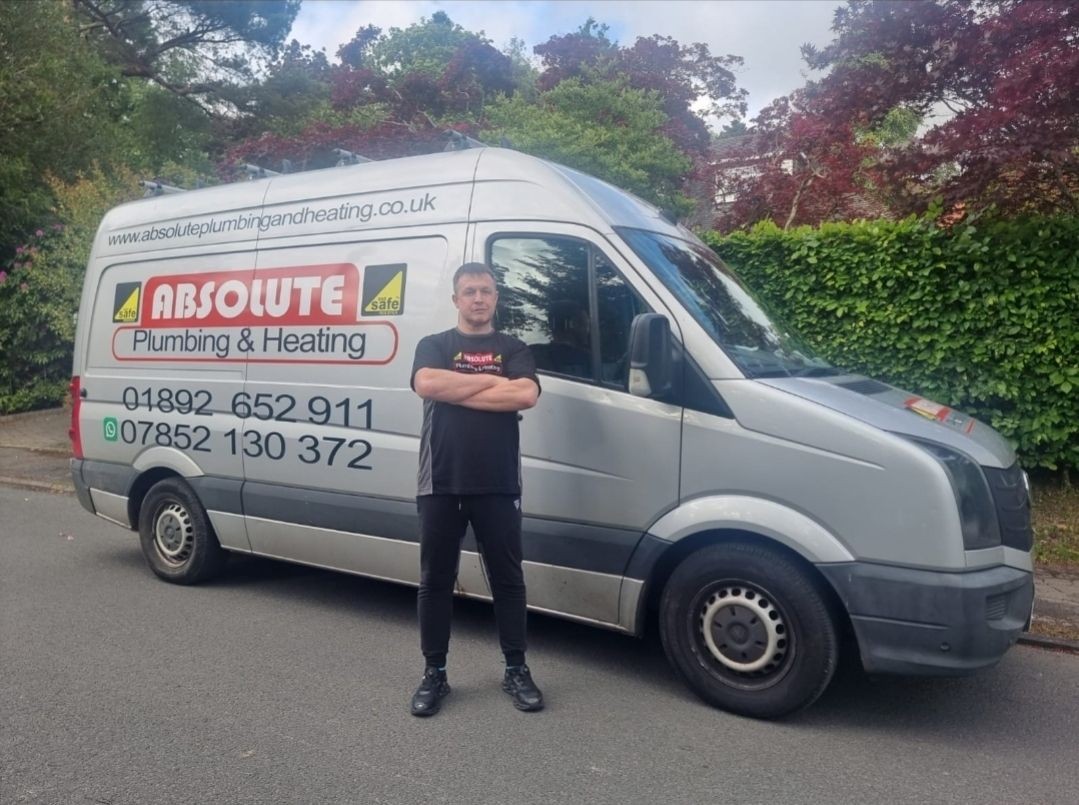 Daniel from Absolute Plumbing & Heating standing beside his van in Crowborough, ready for boiler installations and repairs.